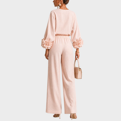 Back view of the blush pink set, showing the gathered waistband and flowers on both cuffs 8