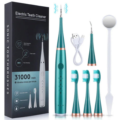 Green version of the set with copper-coloured trim, laid out beside its box with charging cable, scaler head, three brush heads and mirror. 5
