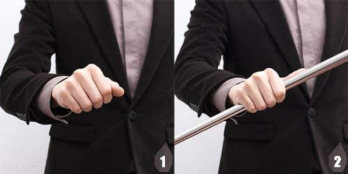 Two-step sequence showing a closed fist in a dark suit sleeve, then the wand extending from it 3