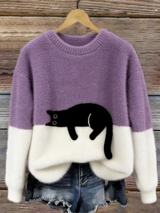 Fluffy jumper with lilac upper half, white lower half and black cat patch, on a hanger 10