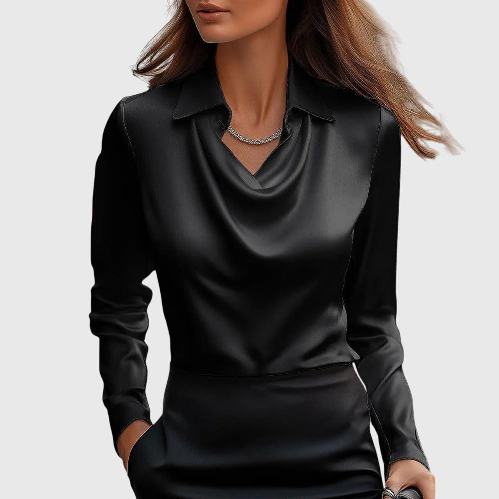 Model wearing the black satin cowl-neck blouse with collar and long sleeves, matched with a black skirt and a slim crystal necklace. 3