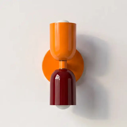Wall lamp with a bright orange upper shade and orange backplate, paired with a glossy burgundy lower shade. 25