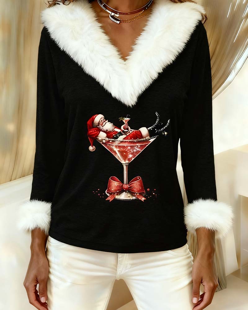 Close-up of the black top showing the glittery Santa-in-cocktail-glass print and fluffy white cuffs 9