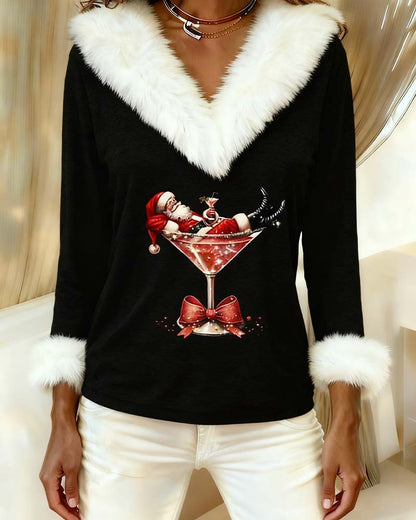 Close-up of the black top showing the glittery Santa-in-cocktail-glass print and fluffy white cuffs 9
