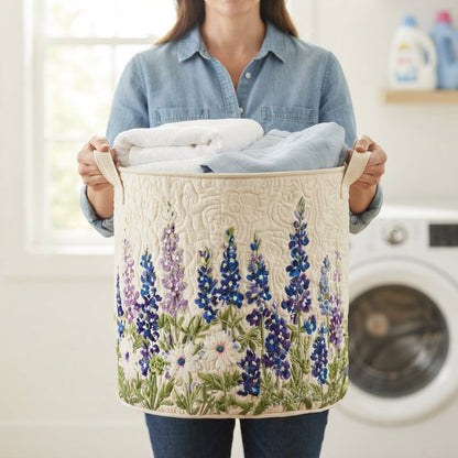 Woman in a denim shirt holding the basket by its two canvas handles, filled with folded white towels, in a laundry room. 4