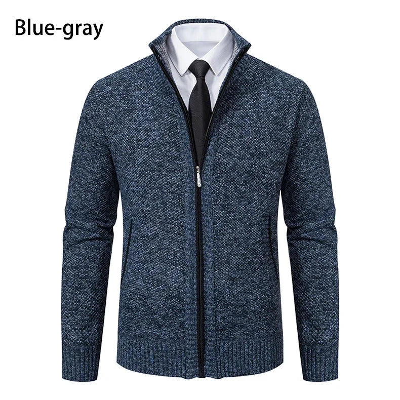 Front view of the blue-grey marl cardigan, zipped partly open over a white shirt and black tie 21