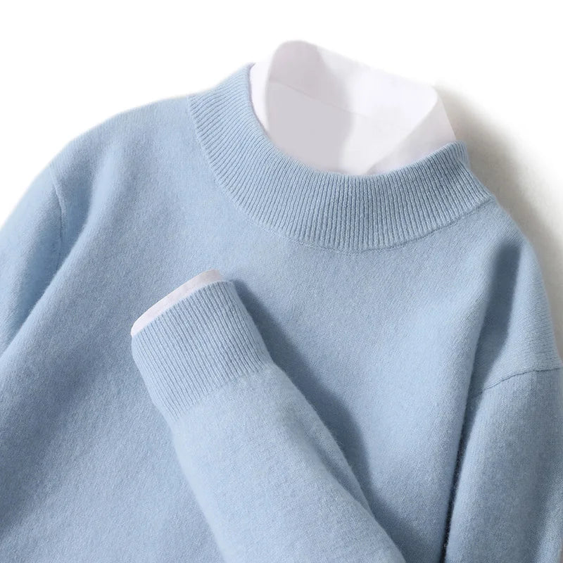 Close-up flat lay of the pale blue knitted jumper with ribbed mock neck and cuff, white shirt underneath 21