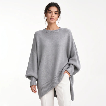 Model wears the oversized grey knit with ribbed trims and balloon sleeves, styled with white trousers 21