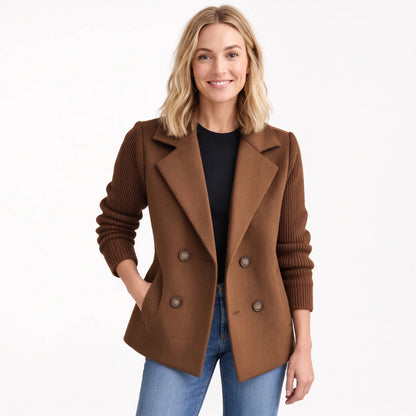 Smiling model in the chocolate brown version, ribbed sleeves and horn-style buttons, worn open over jeans 22