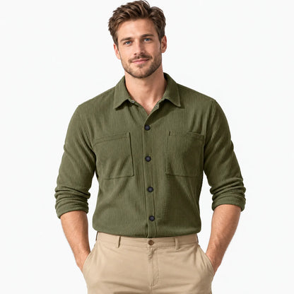 Man wearing the olive green corduroy shirt with dark buttons and two chest pockets, hands in pockets 22