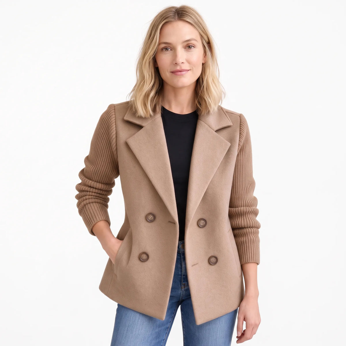 Model wearing the light camel version open, with ribbed knit sleeves, over a black top and jeans 23