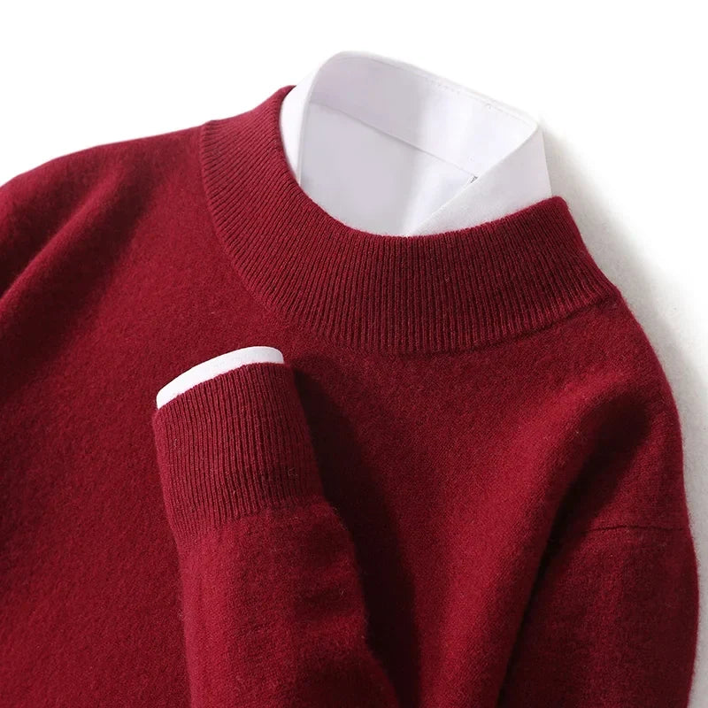Close-up flat lay of the burgundy knitted jumper showing ribbed mock neck and cuff with a white shirt 23