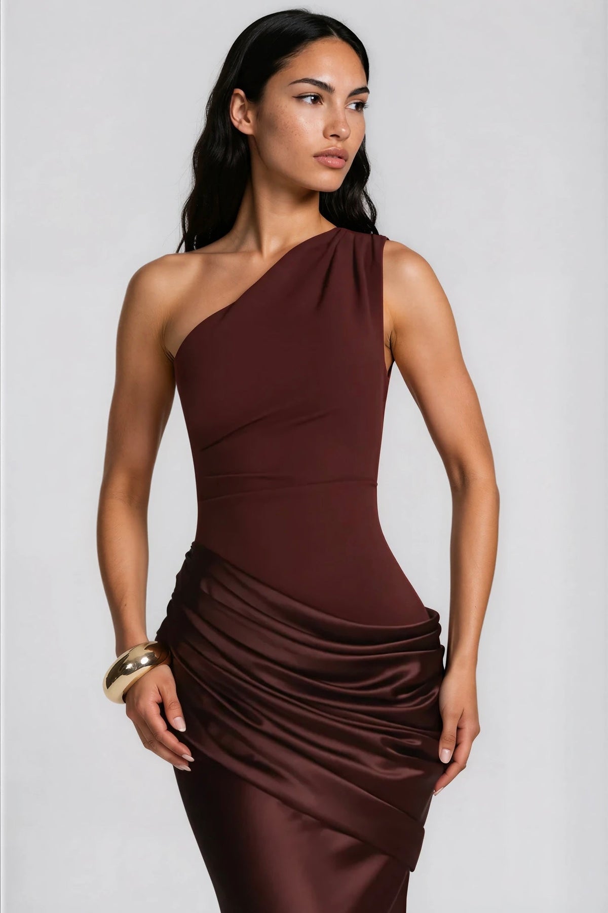 Close-up of the brown dress from the head to the thighs, showing the gathered shoulder, seamed waist and satin drape. 9