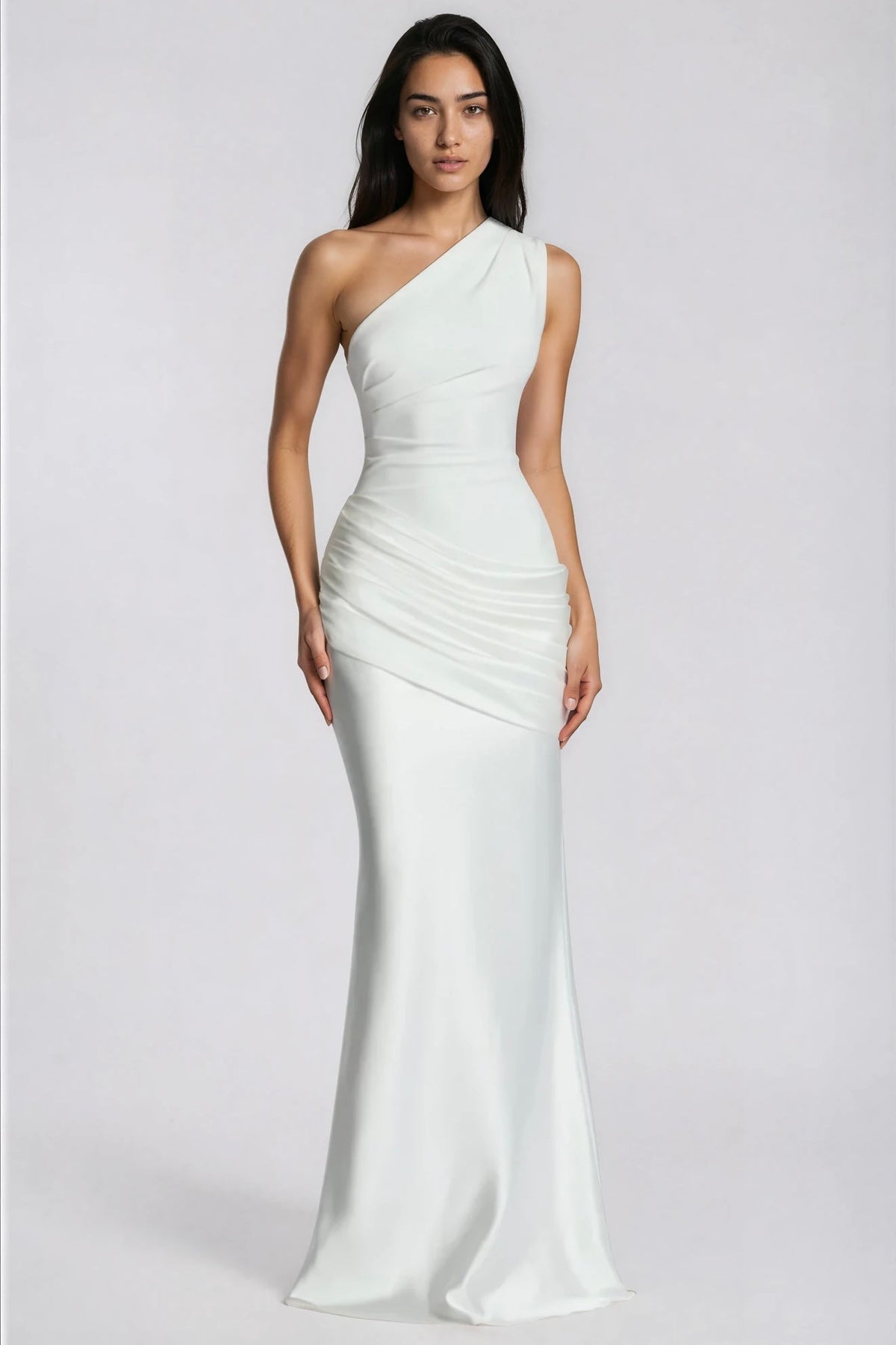 Front view of the white version of the one-shoulder dress, with ruched waist, draped hip panel and smooth satin skirt. 5