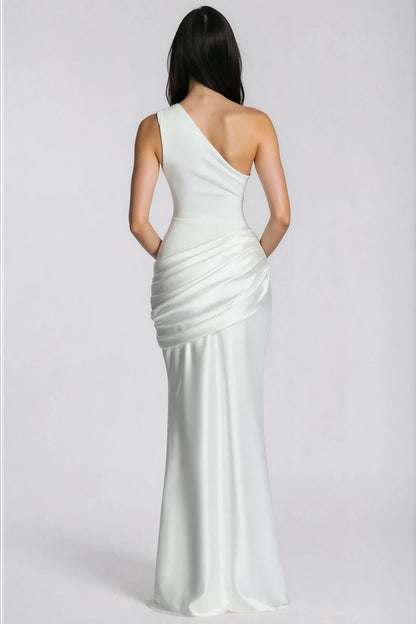 Back view of the white dress, showing the diagonal one-shoulder back and ruched satin panel over the hip. 10