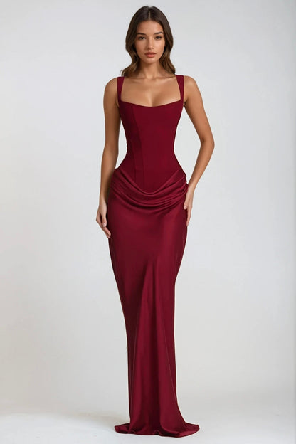 Model standing facing forward in the burgundy maxi dress, hands at her hips, full length 24