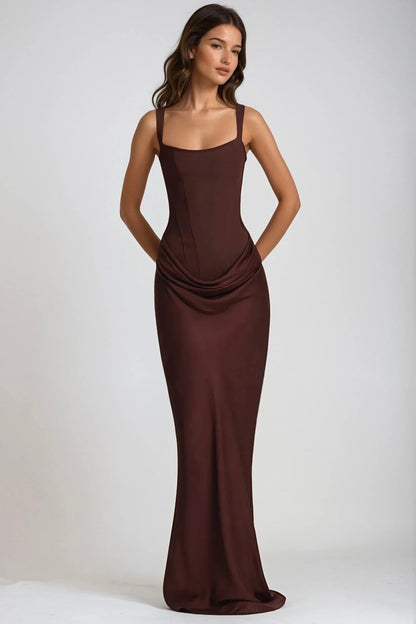 Model in the brown maxi dress with hands behind her back, showing the fitted shape and draping 8