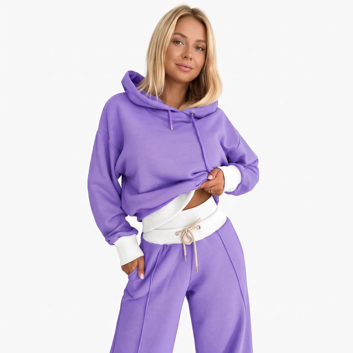 Model wearing the tracksuit in purple with white ribbed hem, cuffs and waistband, beige drawstring 24