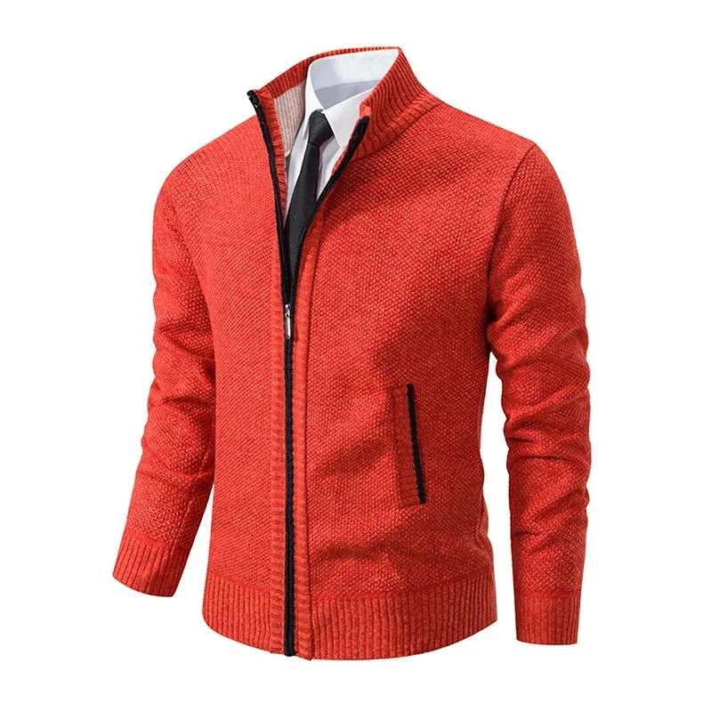 Angled side view of the orange cardigan showing the black-edged pocket, zip and ribbed cuffs 24