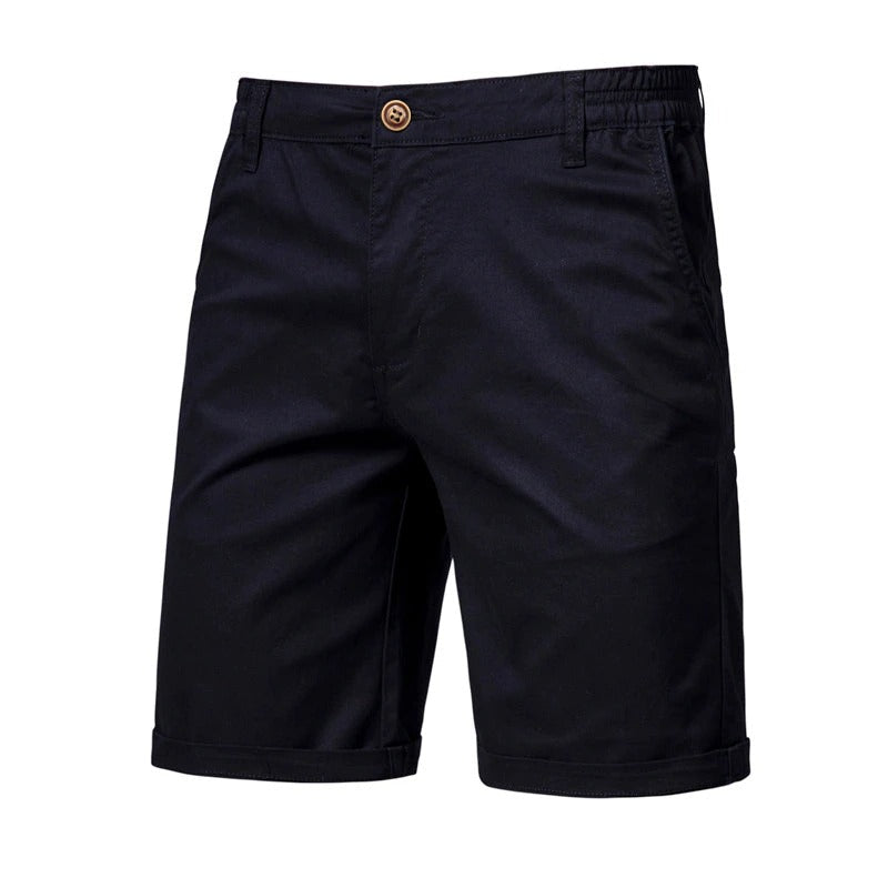 Front view of the shorts in black, with a button fastening, side pockets, belt loops and rolled hems. 6