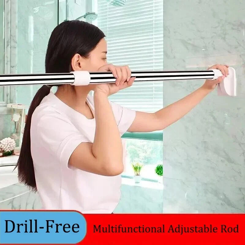 Woman in a white T-shirt pressing a silver telescopic rod with white end caps between two bathroom walls. 1