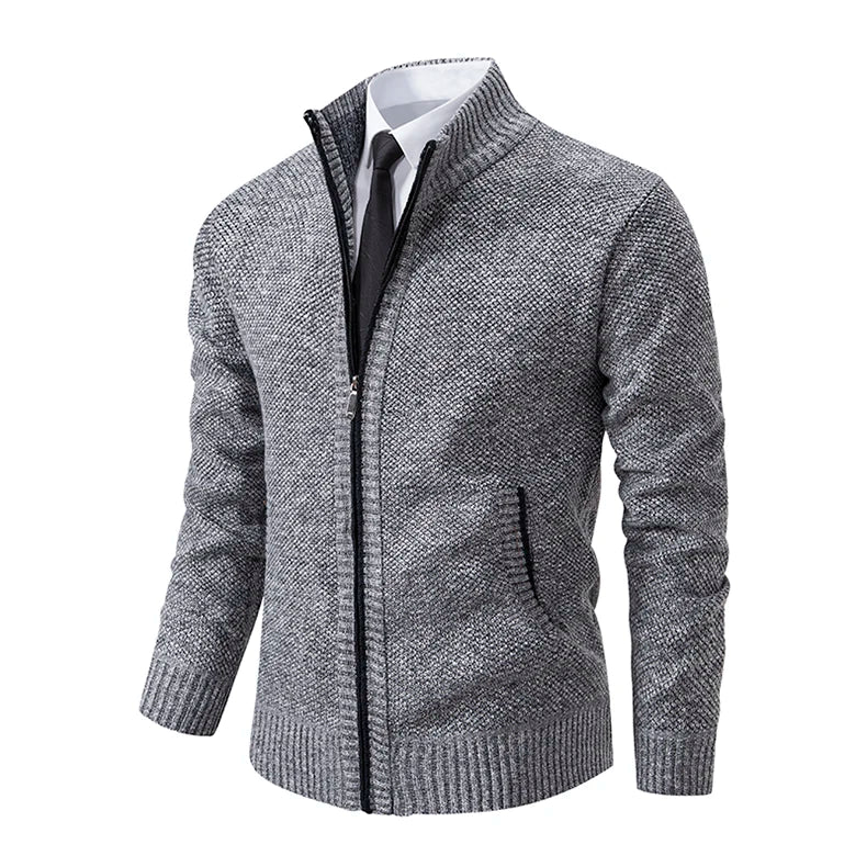 Angled view of the light grey cardigan showing the stand collar, zip and ribbed pocket edge 27