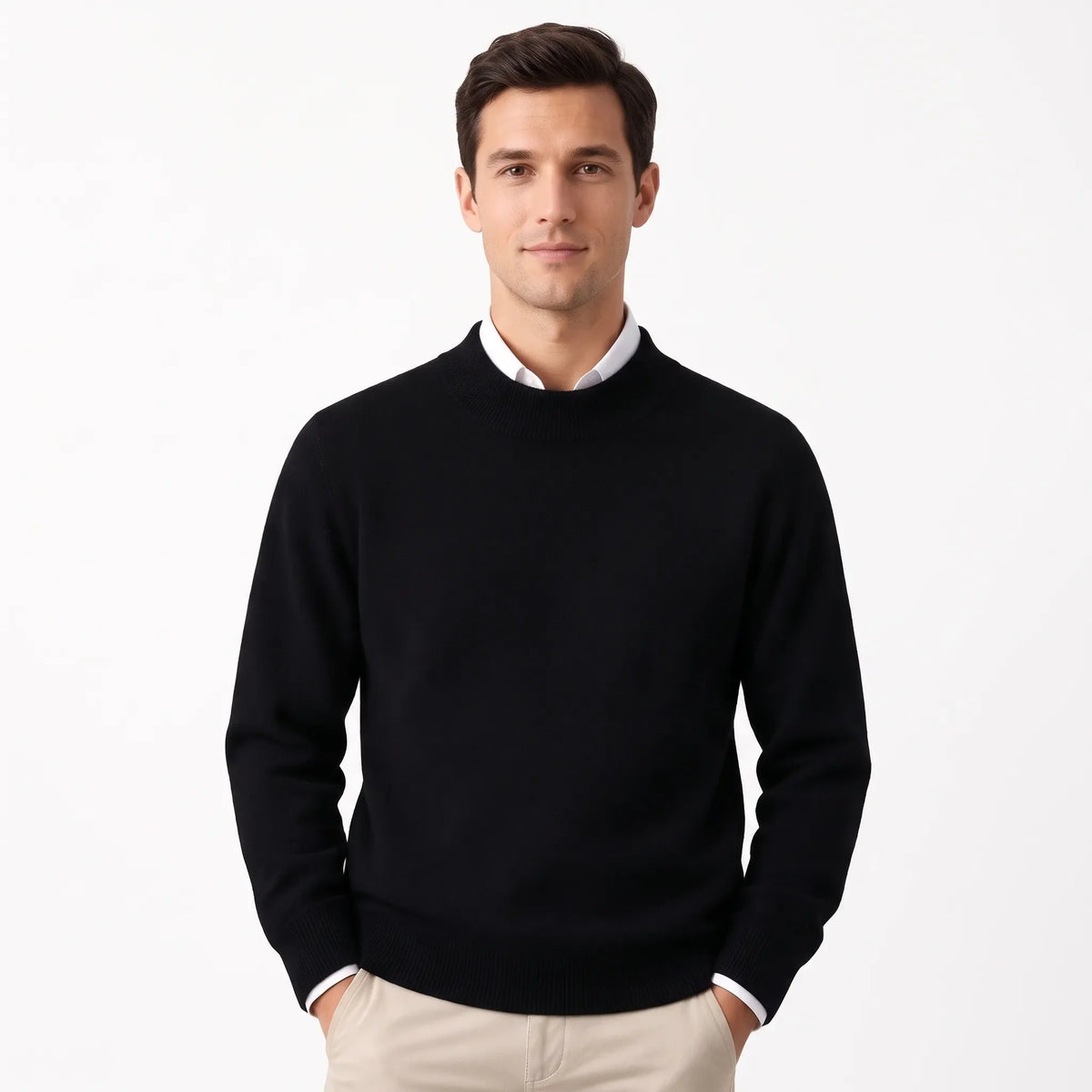Man wearing the black knitted jumper layered over a white collared shirt with beige trousers 28