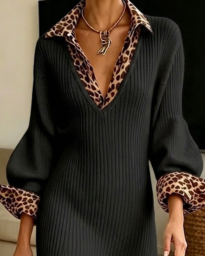 Close-up of the black ribbed dress's V neckline with leopard print collar, balloon sleeves and leopard cuffs. 6