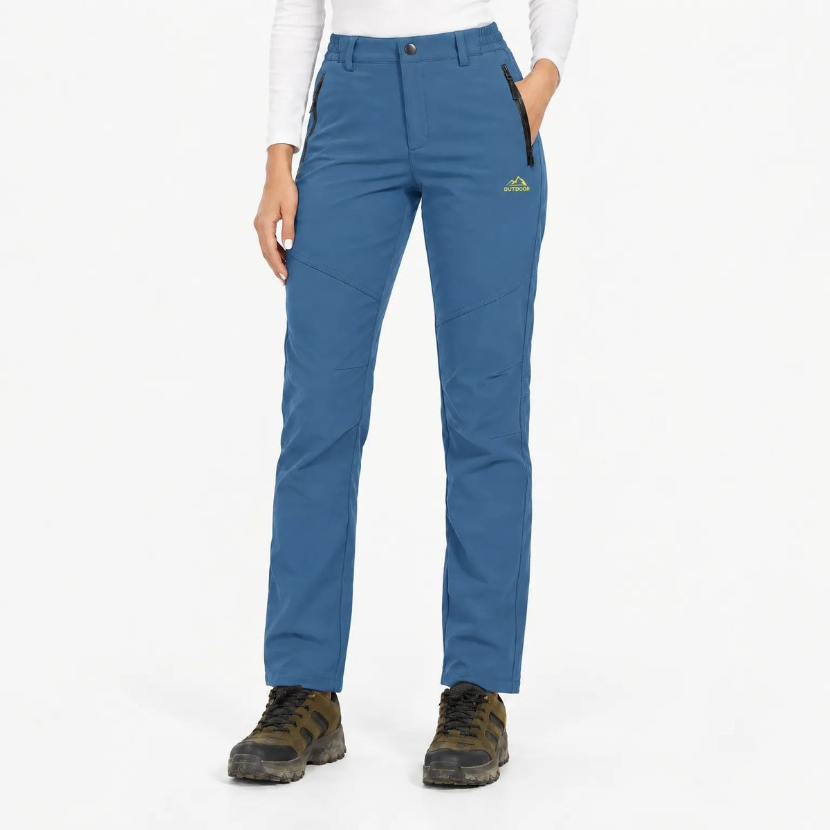 Mid blue trousers worn by a model, front view with angled knee seams and zip pockets 8