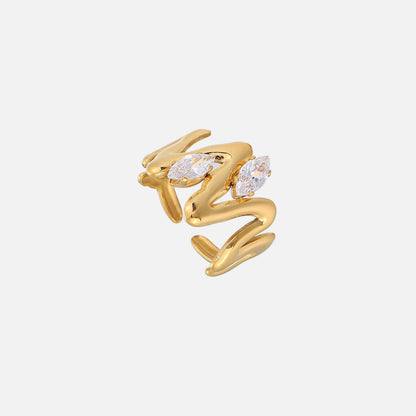 Gold-tone open ring with a wavy, flowing band and two clear marquise-cut stones, seen from above at an angle. 1