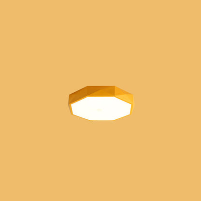 Yellow faceted octagonal flush-mount light floating against a plain yellow background 14