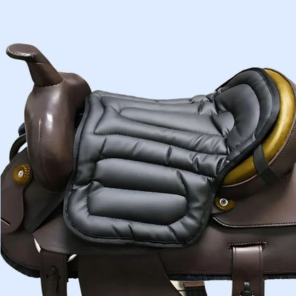 Grey padded seat cushion resting on a brown western saddle with gold-coloured seat, shown from the side 2