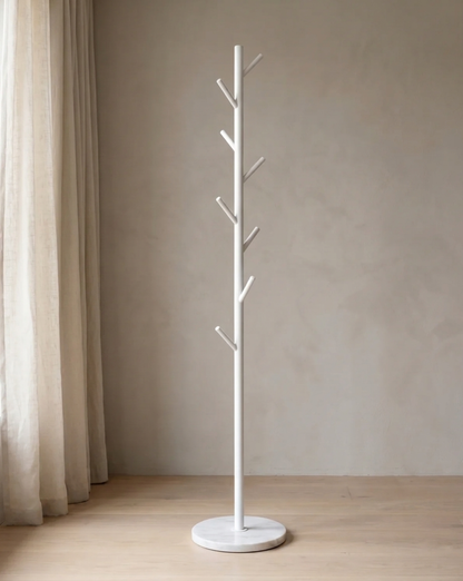 White version of the rack with a round marble-look base, standing empty beside a linen curtain. 2