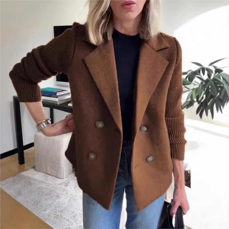 Brown double-breasted jacket with ribbed sleeves, worn over black top and jeans in a living room 2