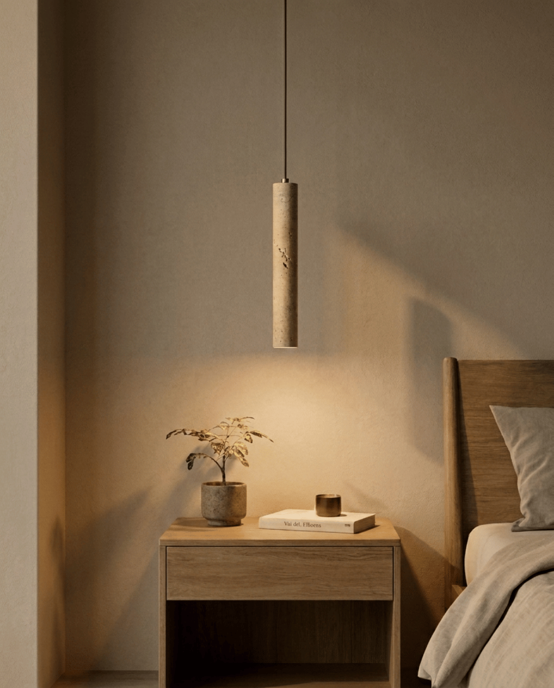 Same pendant lit at dusk, casting a warm pool of light over the bedside table 2