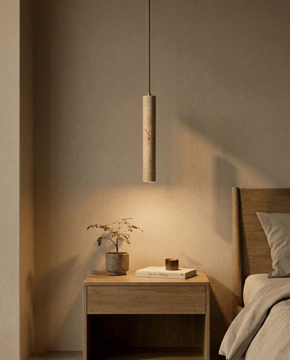 Same pendant lit at dusk, casting a warm pool of light over the bedside table 2