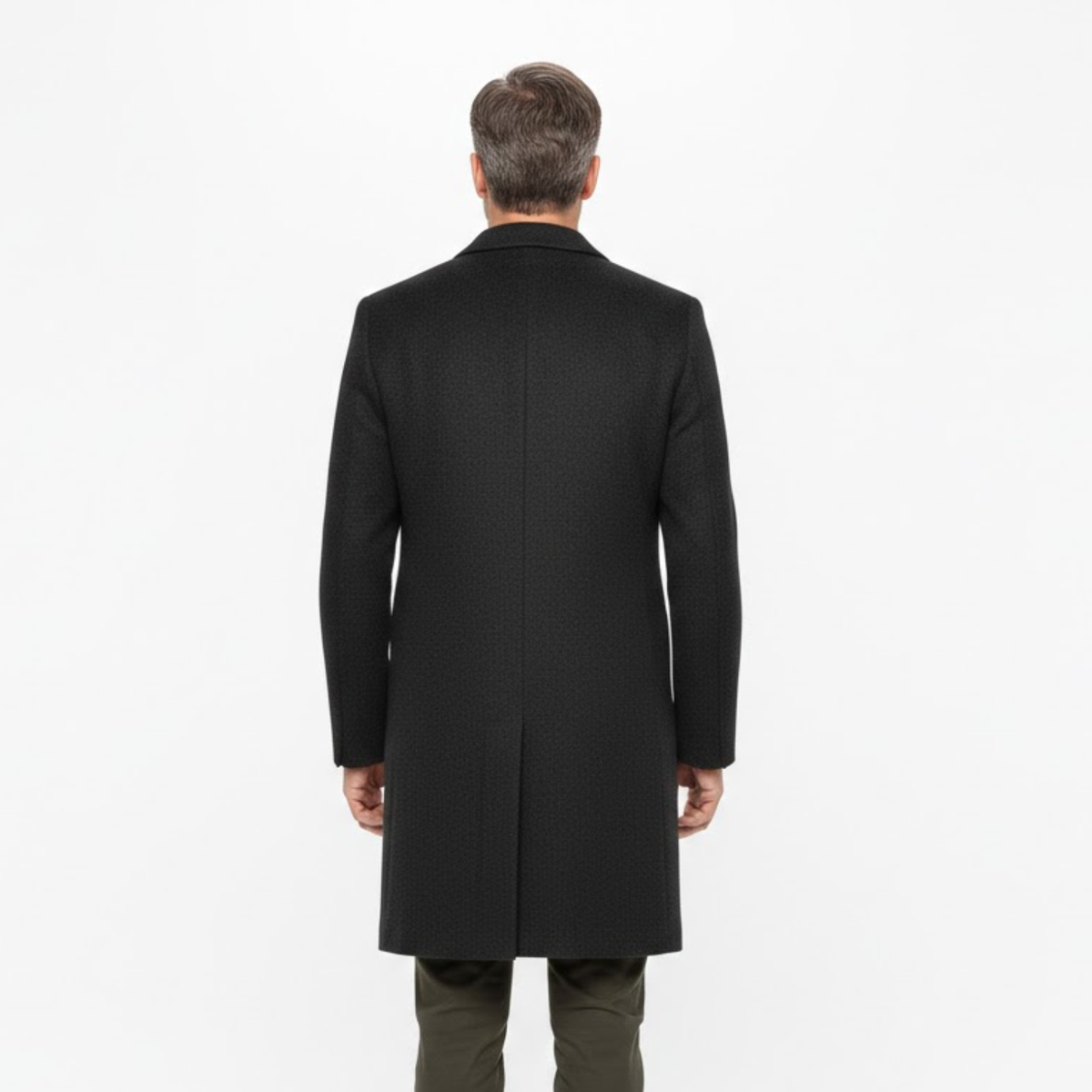 Back view of the coat worn by a model, showing the plain back panel and centre vent 3