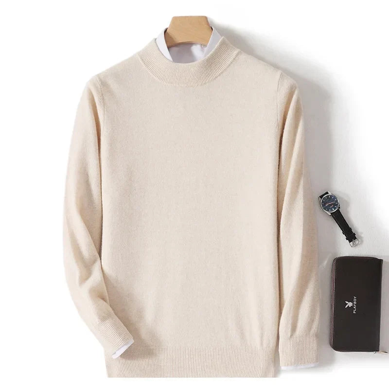 Cream jumper laid flat on a hanger with a white shirt collar, watch and wallet beside it 2