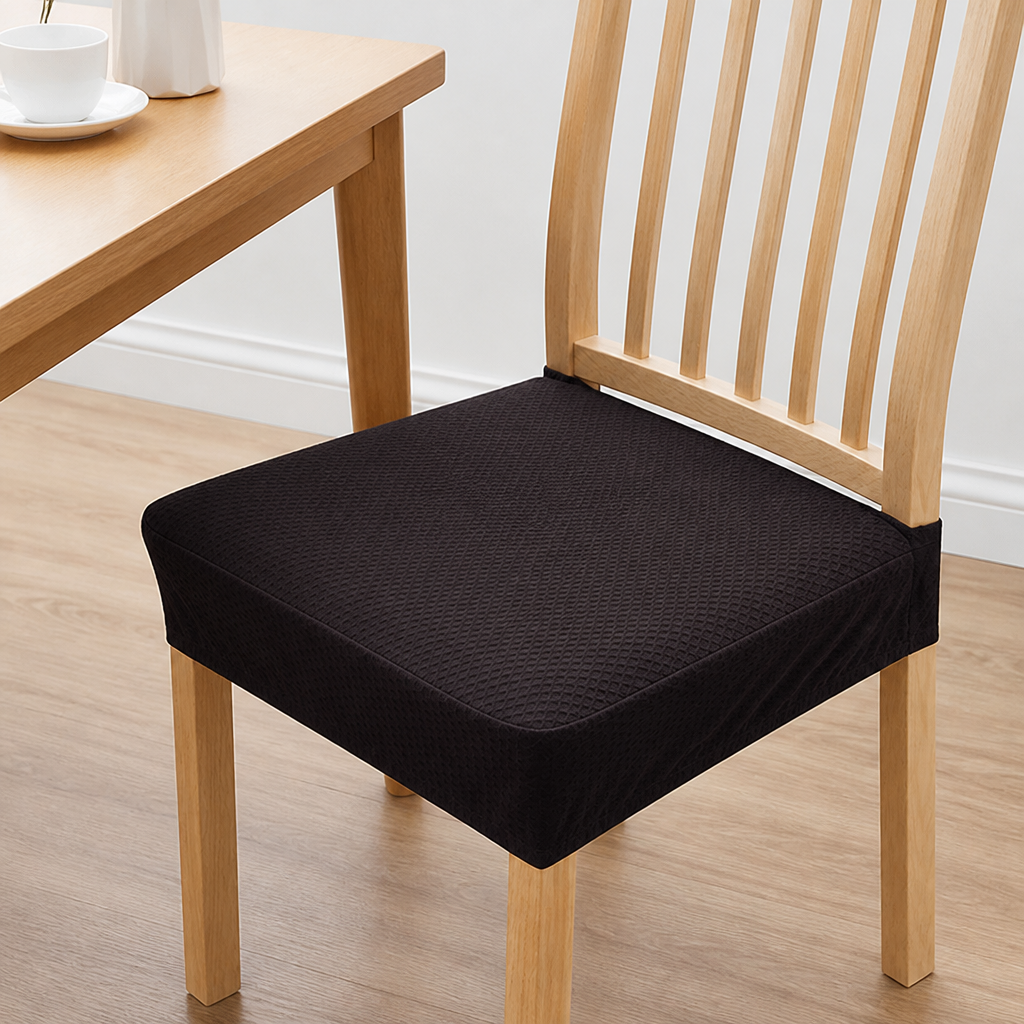 Dark brown textured seat cover on a light wooden slatted chair, pulled up to a wooden table with a cup. 11