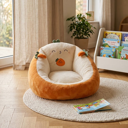 Orange and cream carrot-design bean bag chair on a round woven rug beside a children's bookshelf 1