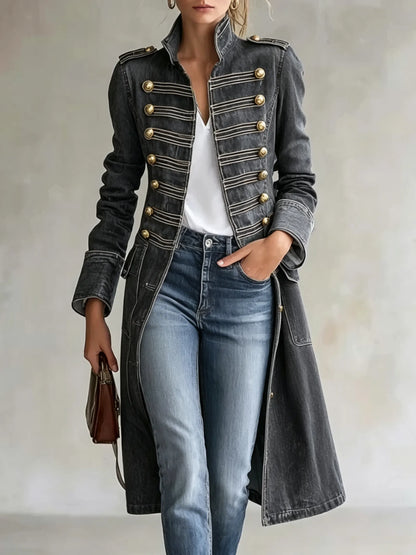 Model wearing the coat in washed charcoal grey denim, open over a white top and jeans, with gold buttons and braiding. 10