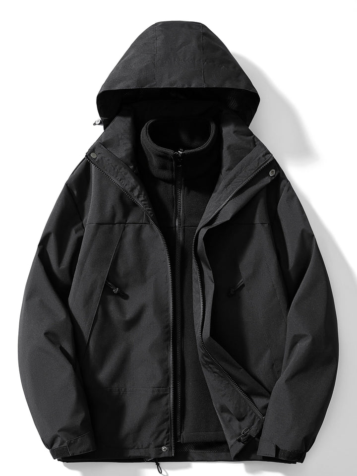 Front view of the all-black version, hood up and outer zip open, revealing the black fleece liner and drawcord pockets. 2