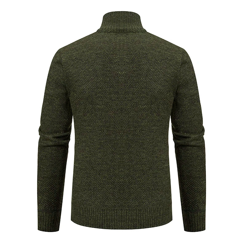 Back view of the dark green knitted cardigan with ribbed high collar and ribbed hem 31