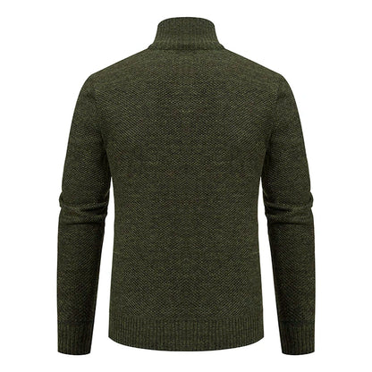 Back view of the dark green knitted cardigan with ribbed high collar and ribbed hem 31