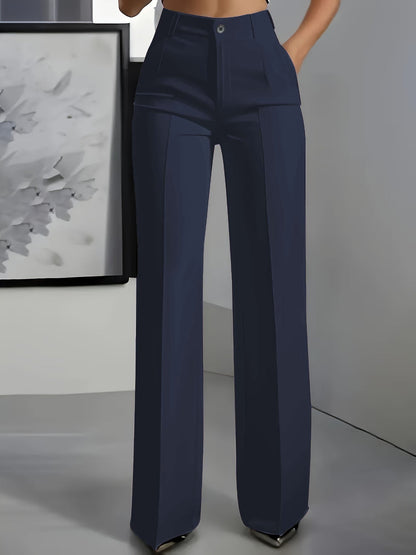 Front view of wide-leg trousers in navy with a centre crease, worn with a hand in the pocket 1