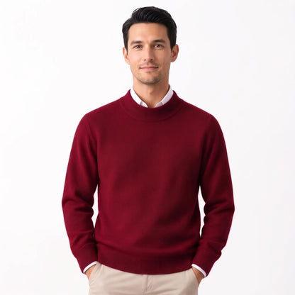 Man wearing the deep burgundy knitted jumper over a white shirt and beige trousers, front view 33