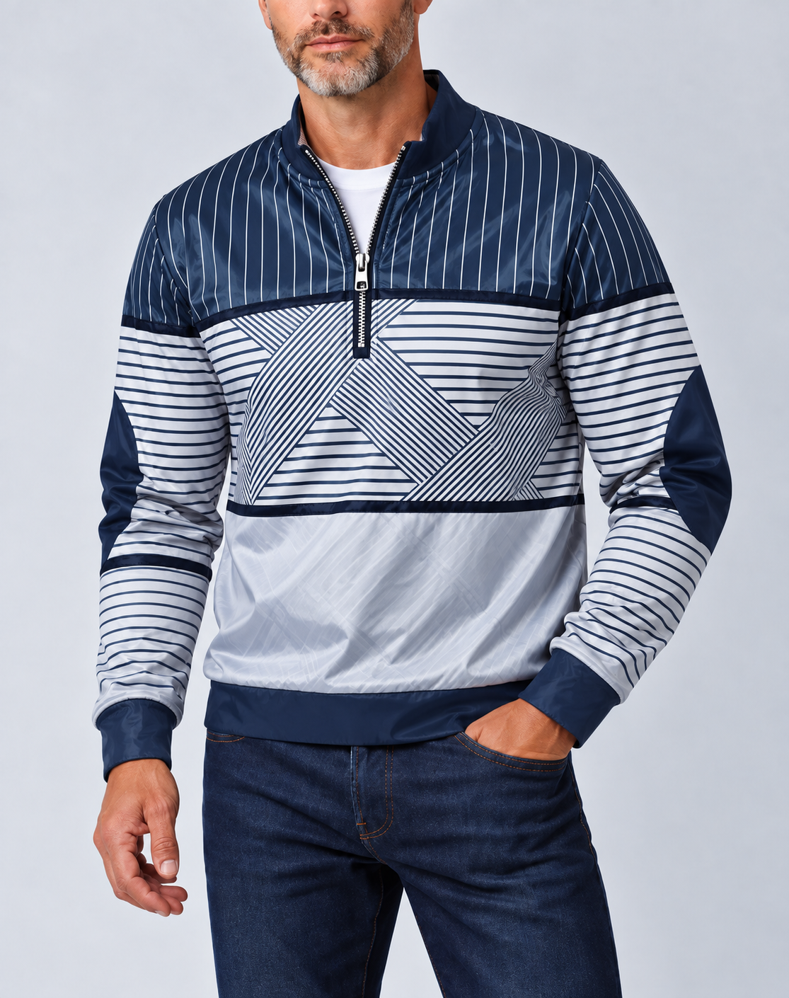 Bearded man wearing the navy and white striped half-zip pullover over a white tee with dark jeans, one hand in pocket. 1