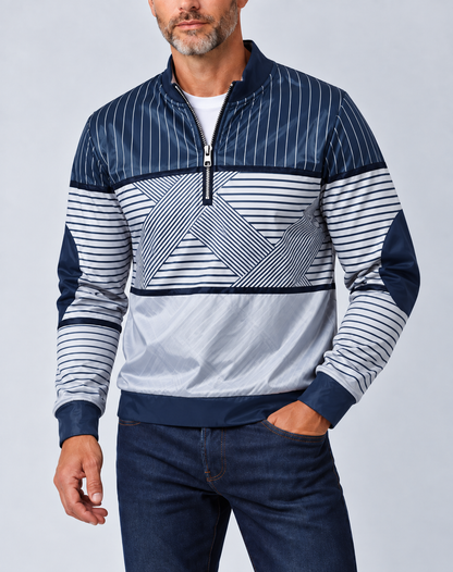 Bearded man wearing the navy and white striped half-zip pullover over a white tee with dark jeans, one hand in pocket. 1