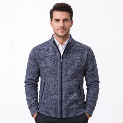 Model wearing the blue-grey marl cardigan zipped up over a white shirt, hands in pockets 35