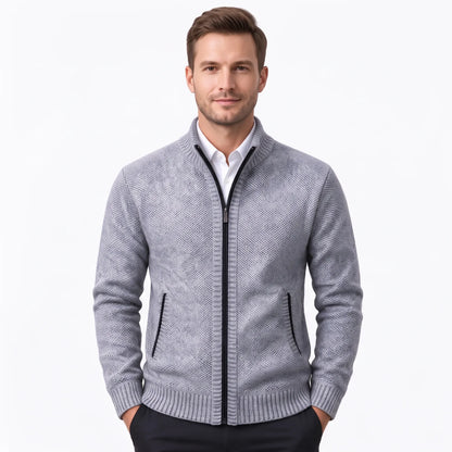 Model wearing the light grey cardigan with black zip over a white shirt and dark trousers 36